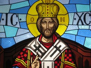 Detail of a stained glass window of an icon depicting Christ the King.